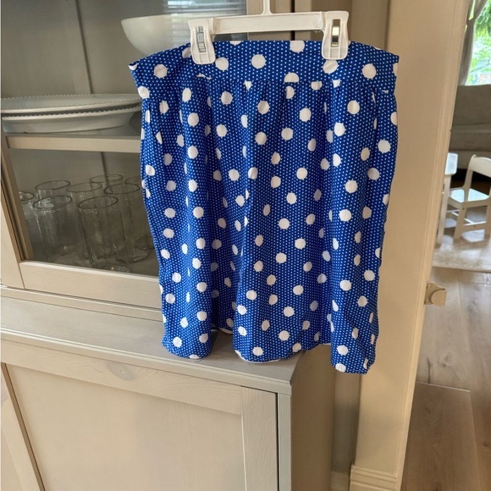 Everly blue with white polka dot skirt. Size S